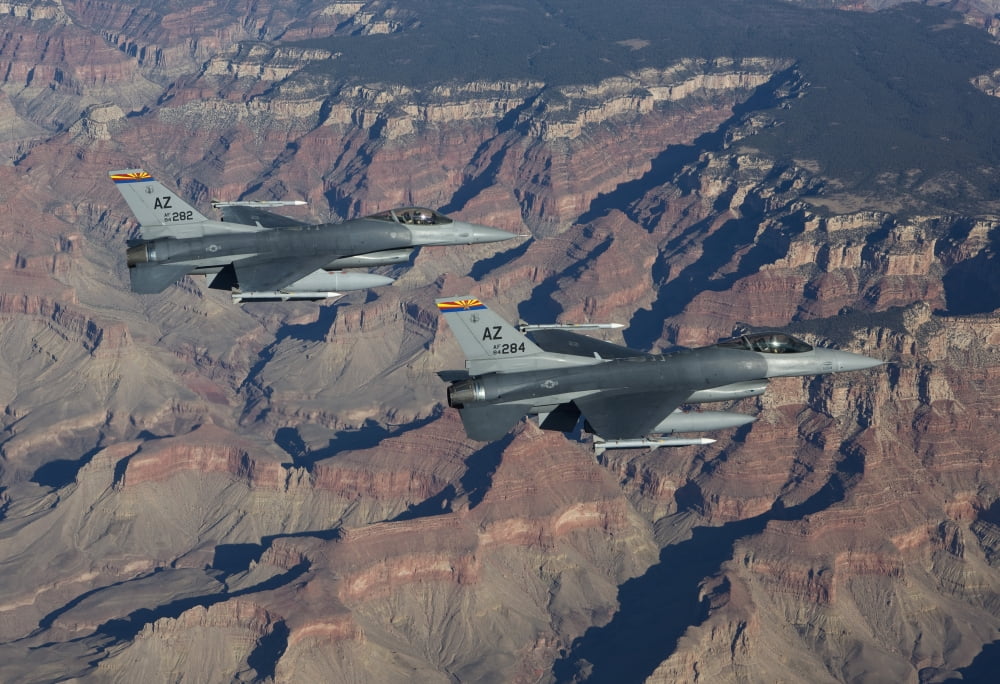 A pair of F-16s fly in formation near the Grand Canyon Arizona Canvas Art - HIGH-G ProductionsStocktrek Images (18 x 12)