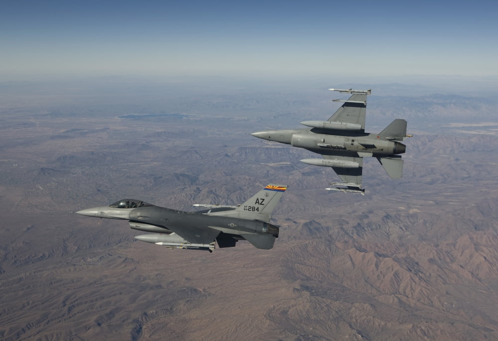 A pair of F-16s fly in formation over Arizona Canvas Art - HIGH-G ProductionsStocktrek Images (18 x 12)