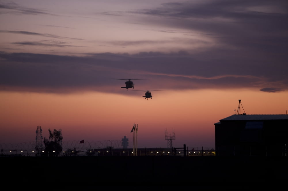 A pair of UH-60 Black Hawk helicopters approach their landing in Baghdad Iraq Canvas Art - Terry MooreStocktrek Images (18 x 12)