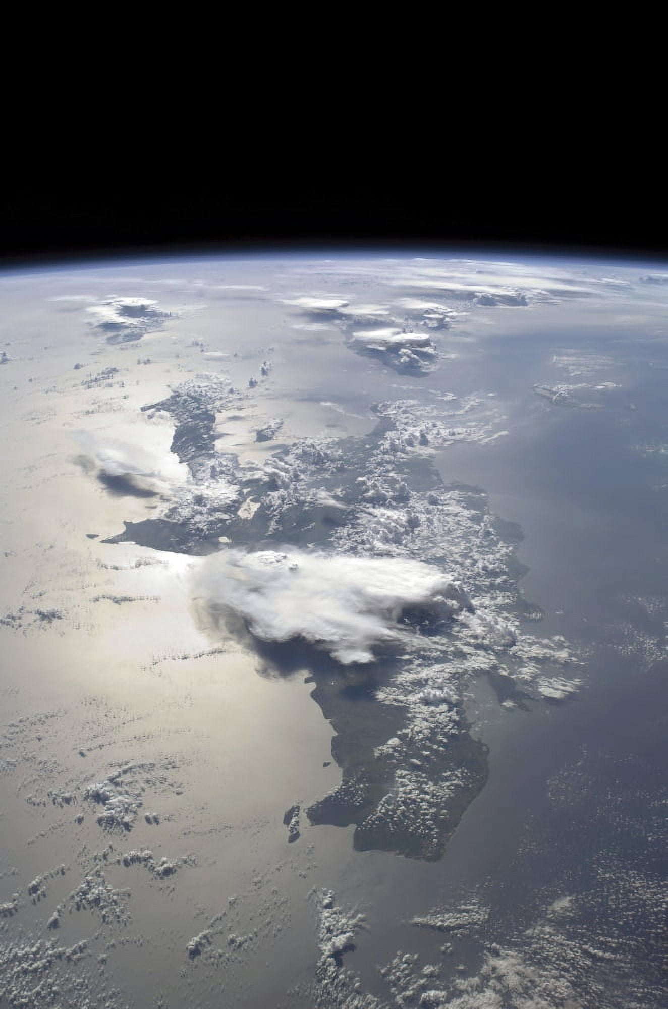 A panoramic view of the island of Hispaniola in the foreground and Cuba extending over the horizon Canvas Art - Stocktrek Images (23 x 34)