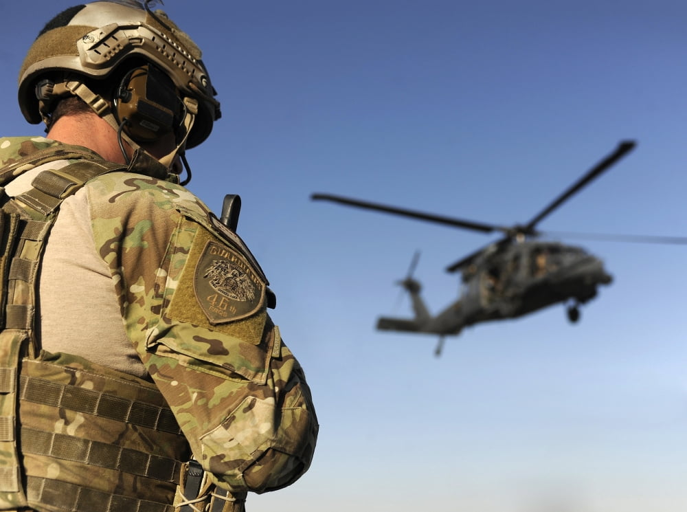 A pararescueman awaits the landing of an HH-60 Pave Hawk Canvas Art - Stocktrek Images (33 x 25)
