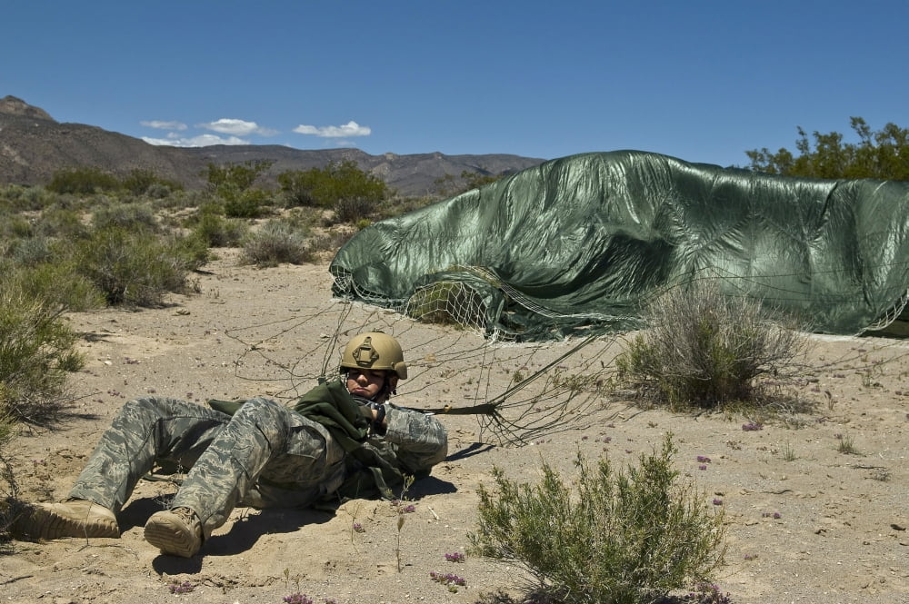 A paratrooper recovers after landing from an air jump Canvas Art - Stocktrek Images (35 x 23)
