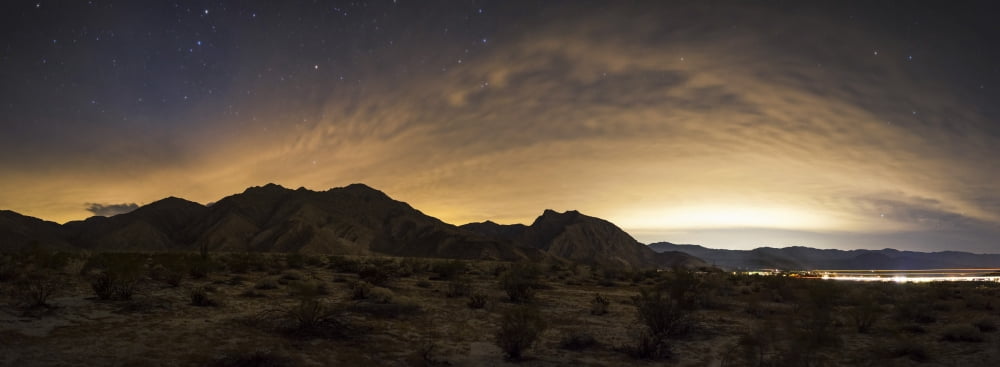A partly coiudy sky over Borrego Springs California Canvas Art - Dan BarrStocktrek Images (24 x 9)
