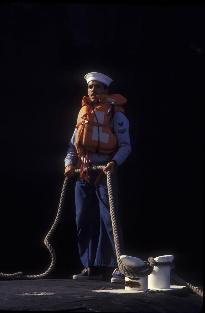 A petty officer secures rope tied alongside the pier Canvas Art - Michael WoodStocktrek Images (12 x 18)