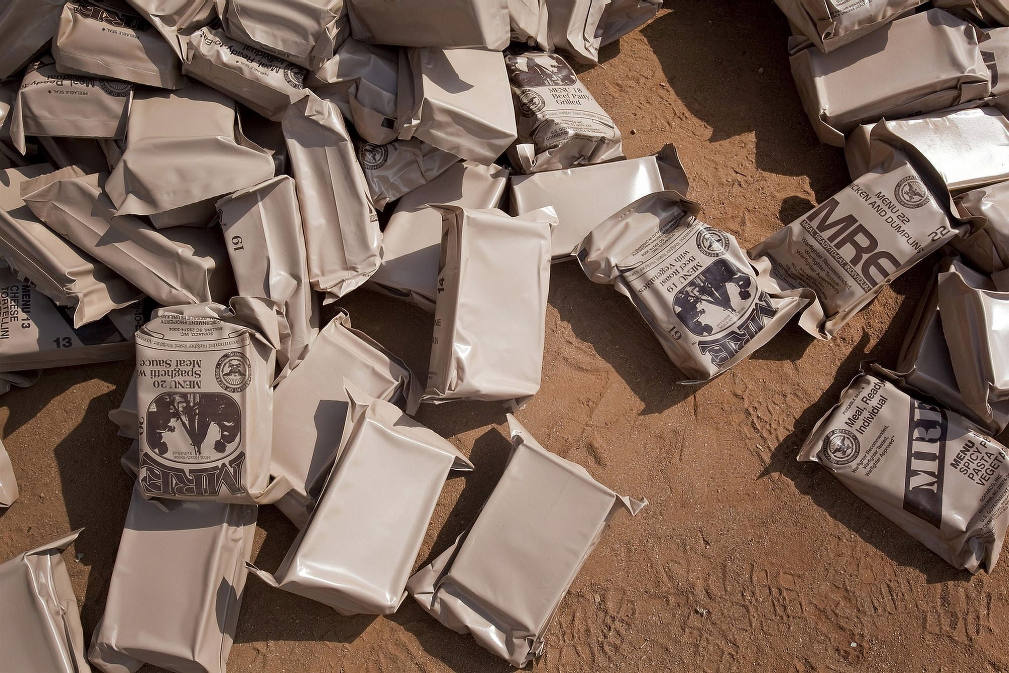 A pile of Meals Ready to Eat lies on the floor at a compound Canvas Art - Stocktrek Images (34 x 23)