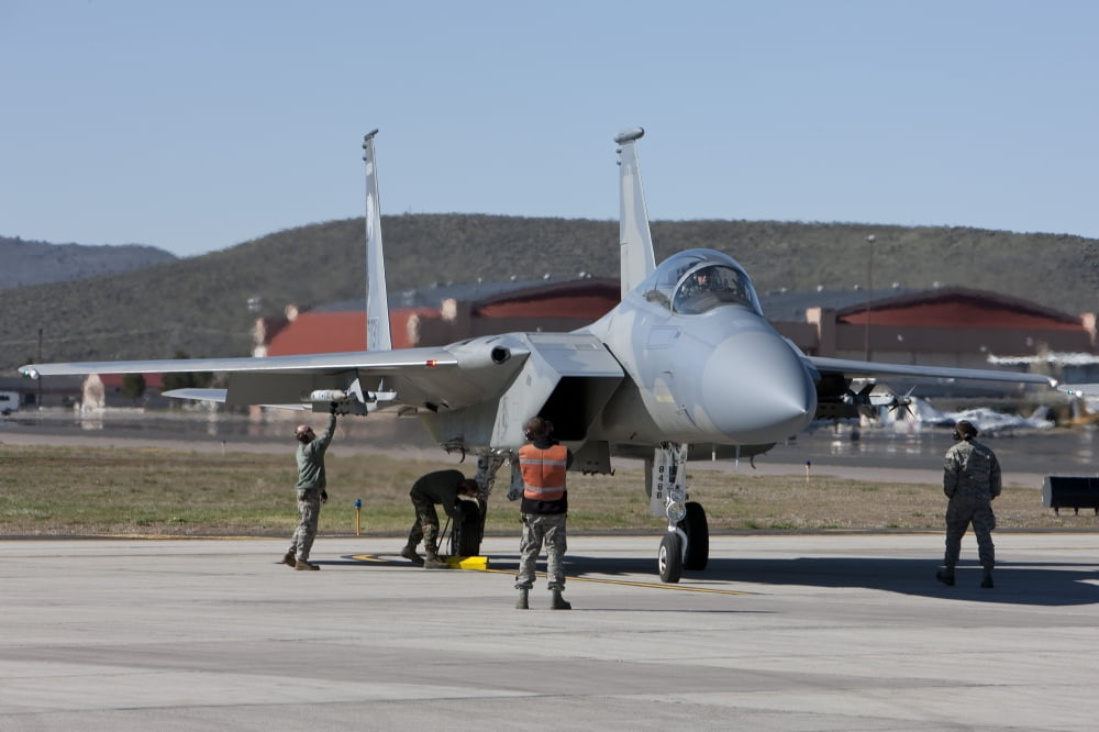 A pilot and ground crew perform preflight checks on an F-15 Eagle Canvas Art - HIGH-G ProductionsStocktrek Images (18 x 12)