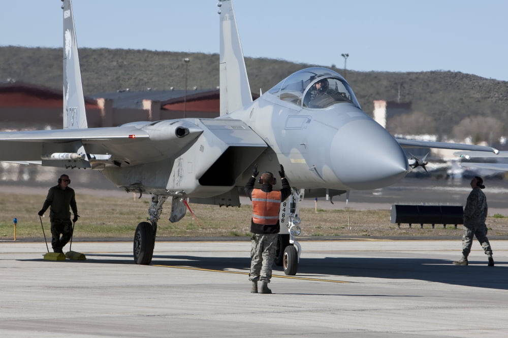 A pilot and ground crew prepare an F-15 Eagle for takeoff Canvas Art - HIGH-G ProductionsStocktrek Images (18 x 12)