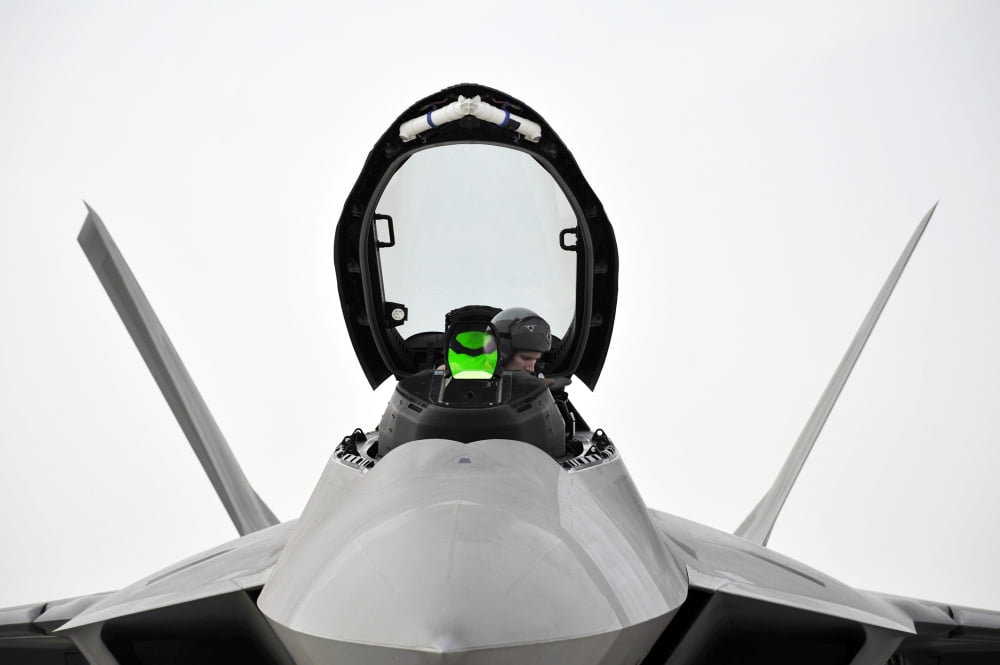 A pilot checks the cockpit of an F-22 Raptor before closing the canopy Canvas Art - Stocktrek Images (34 x 23)