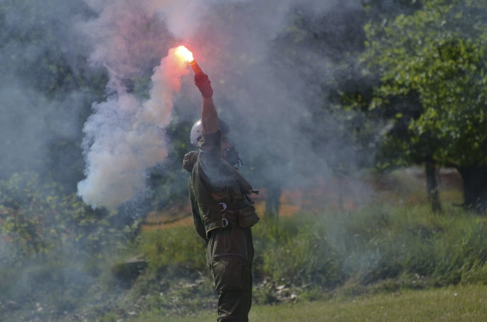A pilot of the Belgian Army using a light and smoke beacon Canvas Art - Luc De JaegerStocktrek Images (18 x 12)
