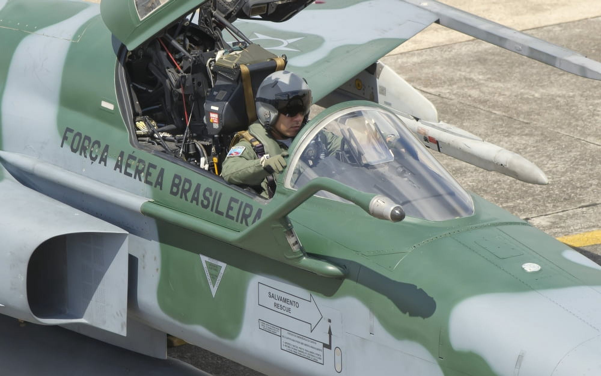 A pilot sitting in the cockpit of a Brazilian Air Force F-5 aircraft Canvas Art - Giovanni CollaStocktrek Images (36 x 23)