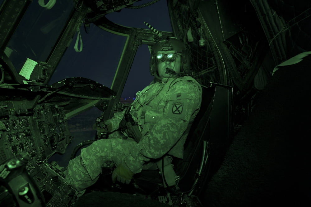 A pilot wears night vision goggles in the cockpit of a CH-47 Chinook helicopter Canvas Art - Terry MooreStocktrek Images (18 x 12)