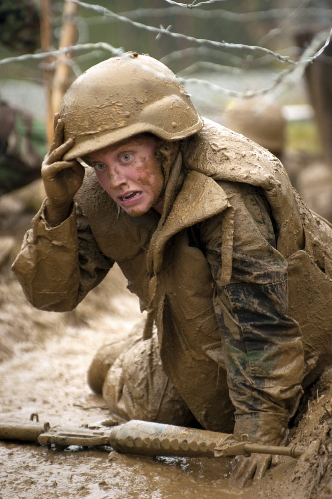A plebe navigates the low crawl obstacle during Sea Trials at the US Naval Academy Canvas Art - Stocktrek Images (23 x 34)