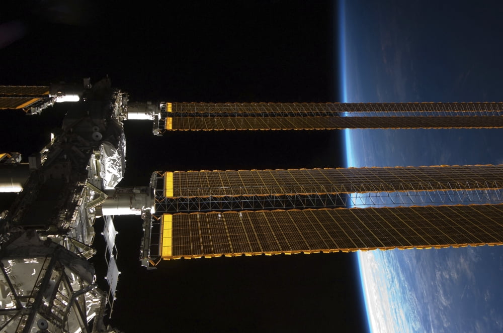 A portion of the International Space Station Canvas Art - Stocktrek Images (34 x 23)