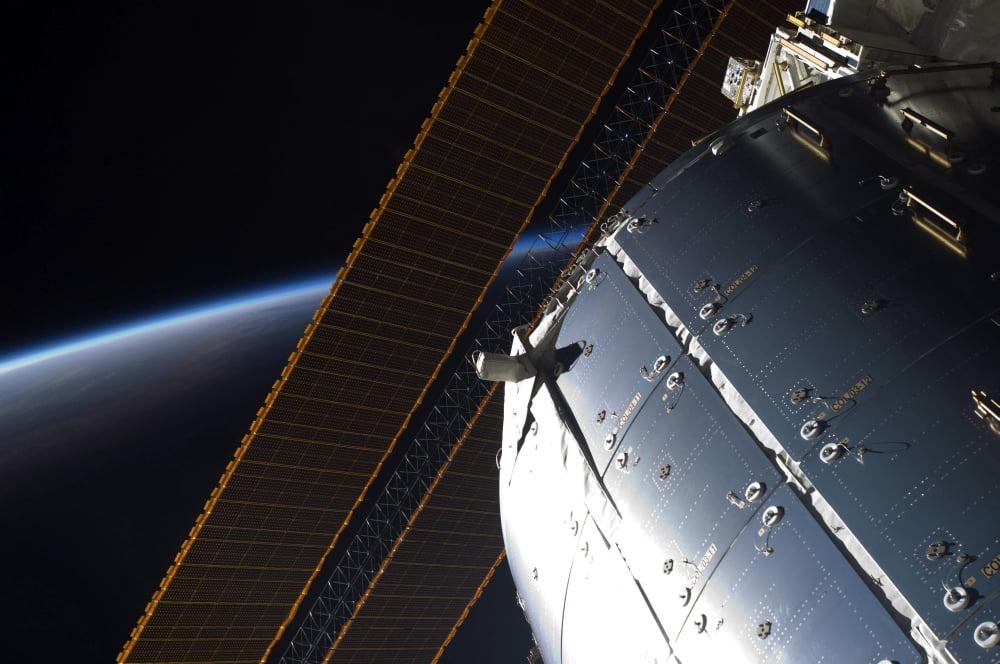 A portion of the International Space Stations Columbus laboratory and solar array panels Canvas Art - Stocktrek Images (35 x 23)