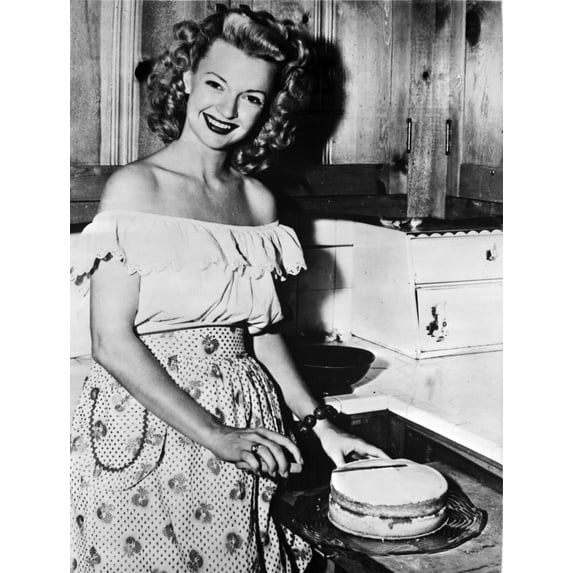 A portrait of Dale Evans with a cake Photo Print (24 x 30)