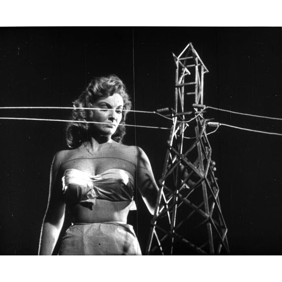 A publicity still of Alison Hayes next to a power pylon Photo Print (24 x 30)