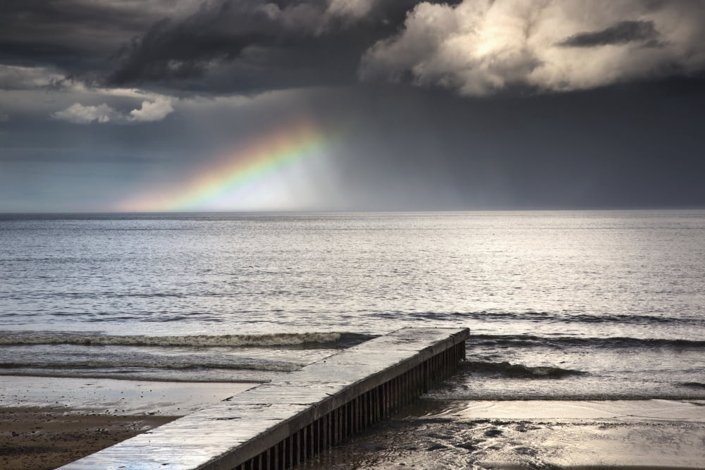 A rainbow shining in the storm cloudsBlyth northumberland england Canvas Art - John Short Design Pics (19 x 12)
