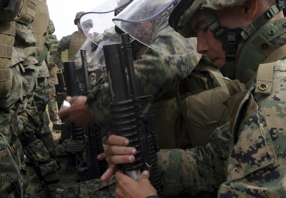 A rifleman loads a foam baton round into his M203 grenade launcher Canvas Art - Stocktrek Images (33 x 23)
