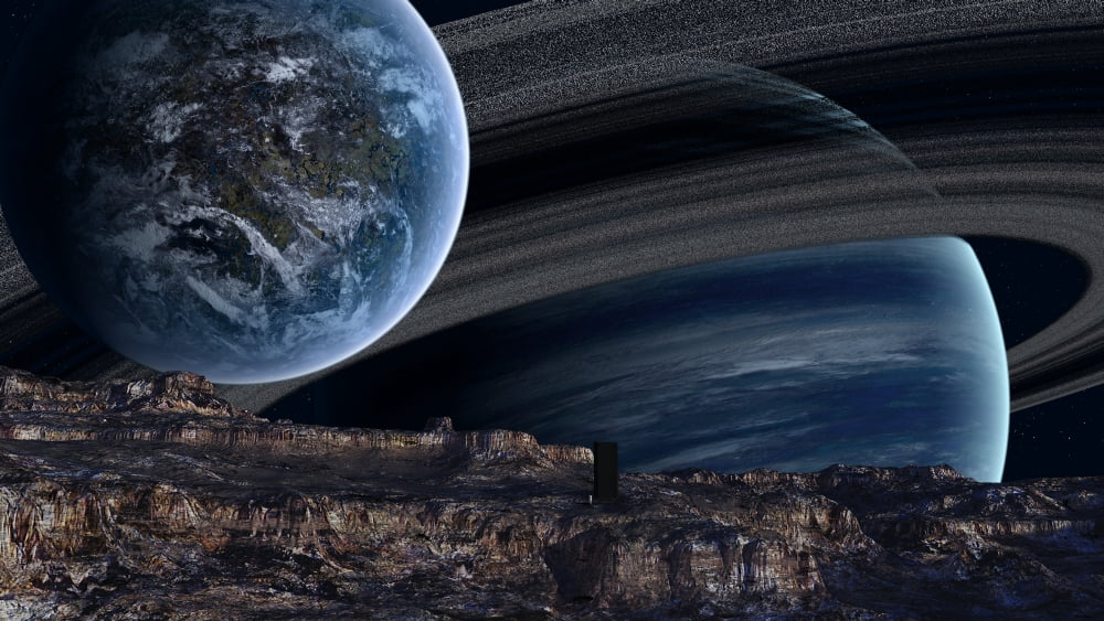 A ringed gas giant is home to several worlds and worldlets Canvas Art - Frieso HoevelkampStocktrek Images (38 x 22)