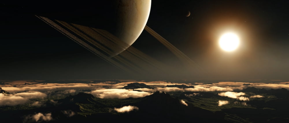 A ringed planet rises in the night sky of an alien world Canvas Art - Frieso HoevelkampStocktrek Images (44 x 19)