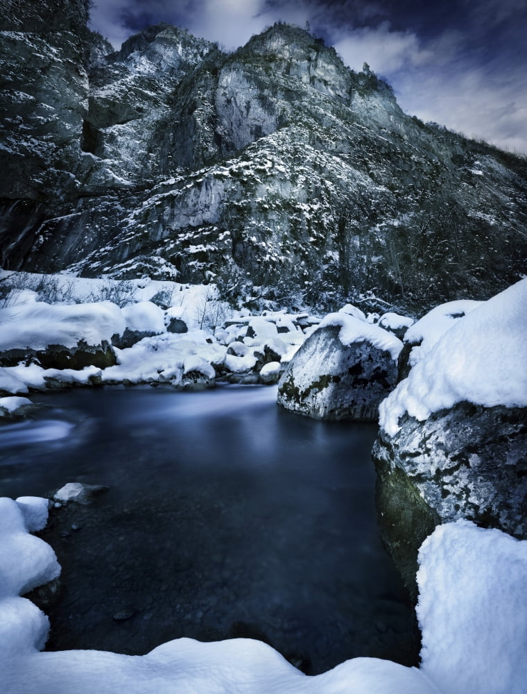 A river flowing through the snowy mountains of Ritsa Nature Reserve Abkhazia Canvas Art - Evgeny KuklevStocktrek Images (13 x 17)