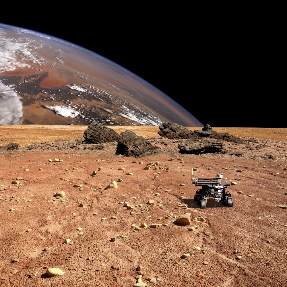 A robotic rover explores an alien world with a large planet at horizon Canvas Art - Marc WardStocktrek Images (29 x 29)