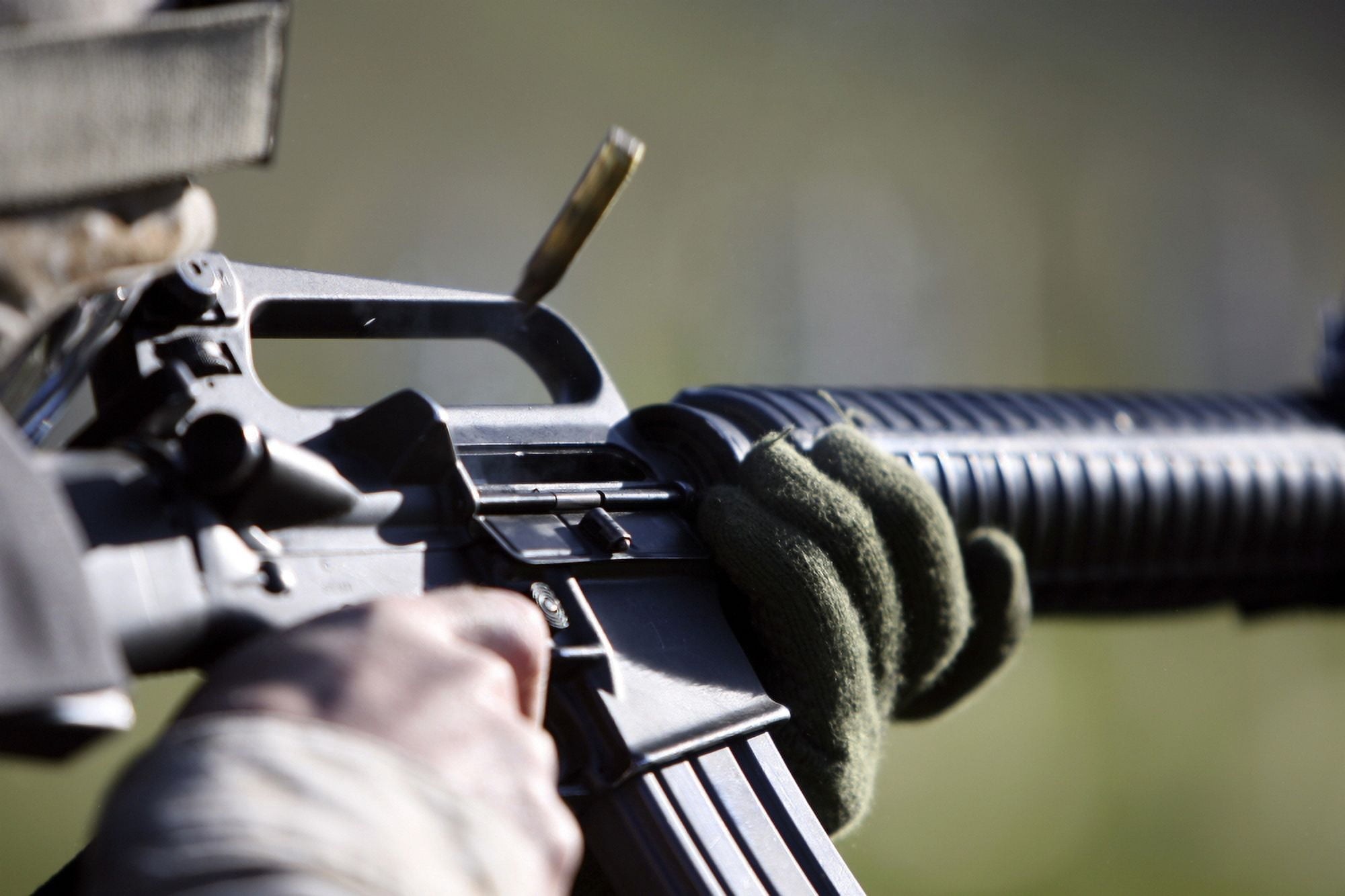 A round flies from the chamber of an M-16A2 service rifle Canvas Art - Stocktrek Images (34 x 23)