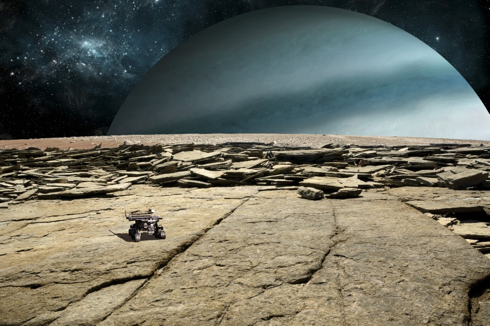 A rover explores the surface of a rocky and barren moon Canvas Art - Marc WardStocktrek Images (18 x 12)