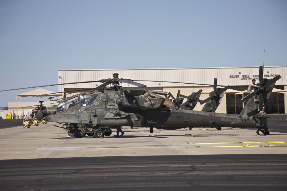 A row of AH-64D Apache Longbow helicopters Canvas Art - Terry MooreStocktrek Images (18 x 12)