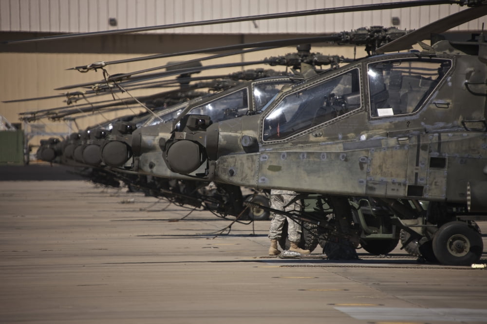 A row of AH-64D Apache helicopters at Pinal Airpark Arizona Canvas Art - Terry MooreStocktrek Images (35 x 23)