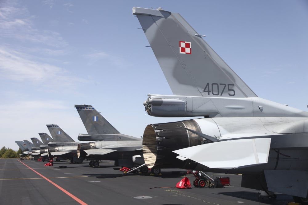 A row of F-16 jets from the Polish and Greek Air Forces Albacete Air Base Spain Canvas Art - Timm ZiegenthalerStocktrek Images (18 x 12)