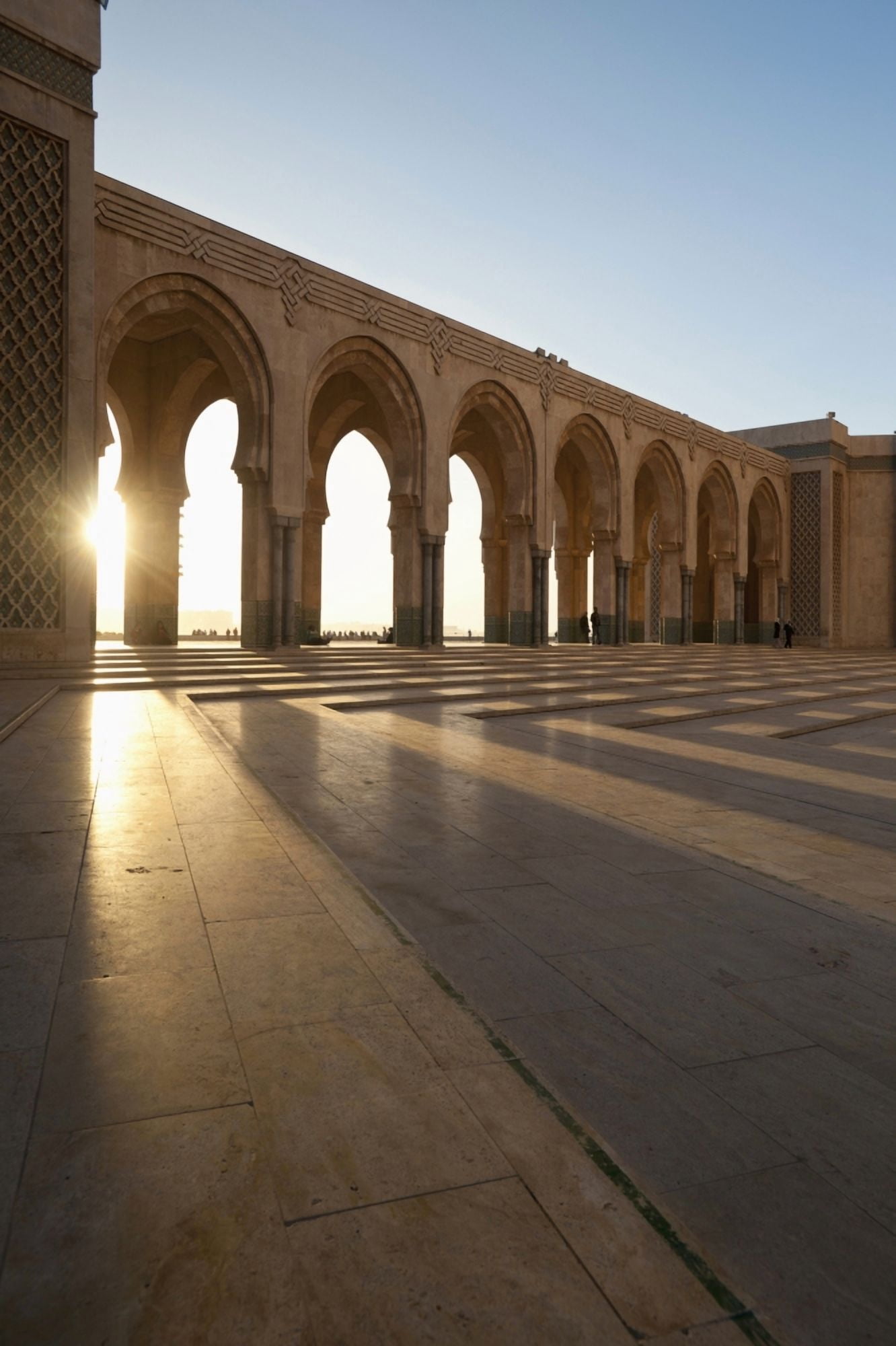 A row of archways against a blue sky and sunlight shining through Casablanca Morocco Canvas Art - Ian Cumming Design Pics (12 x 19)