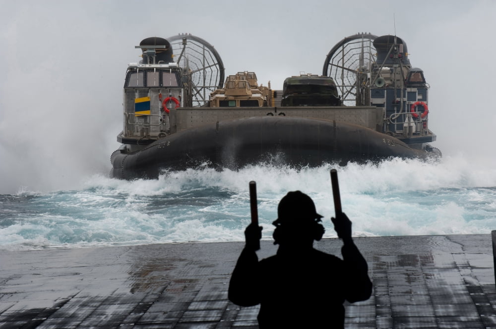 A sailor guides a landing craft air cushion as it approaches the well deck of USS New Orleans Canvas Art - Stocktrek Images (35 x 24)