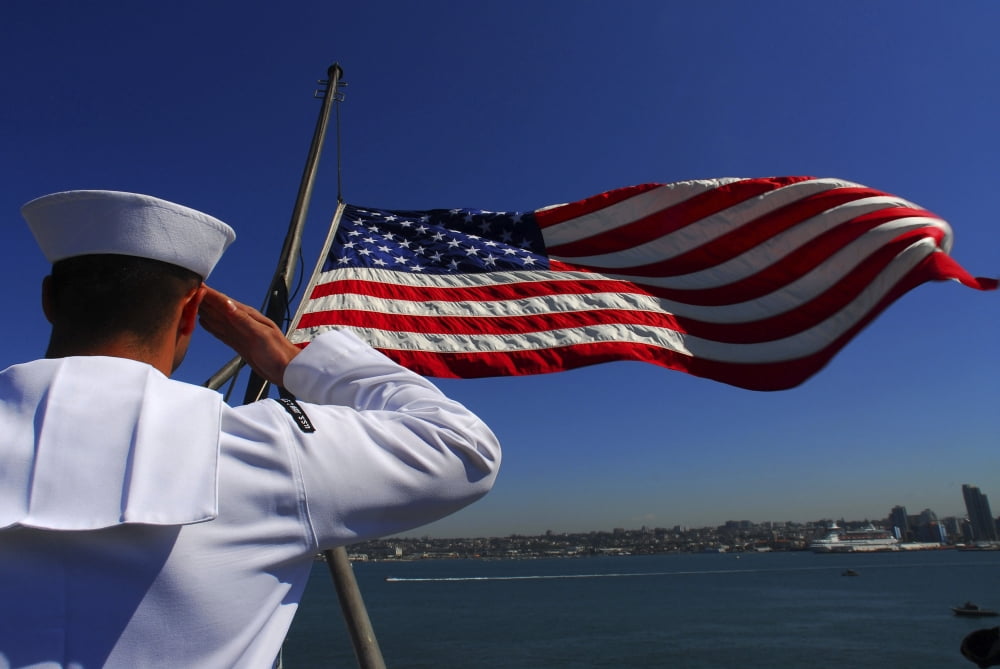 A sailor salutes the American flag Canvas Art - Stocktrek Images (34 x 23)