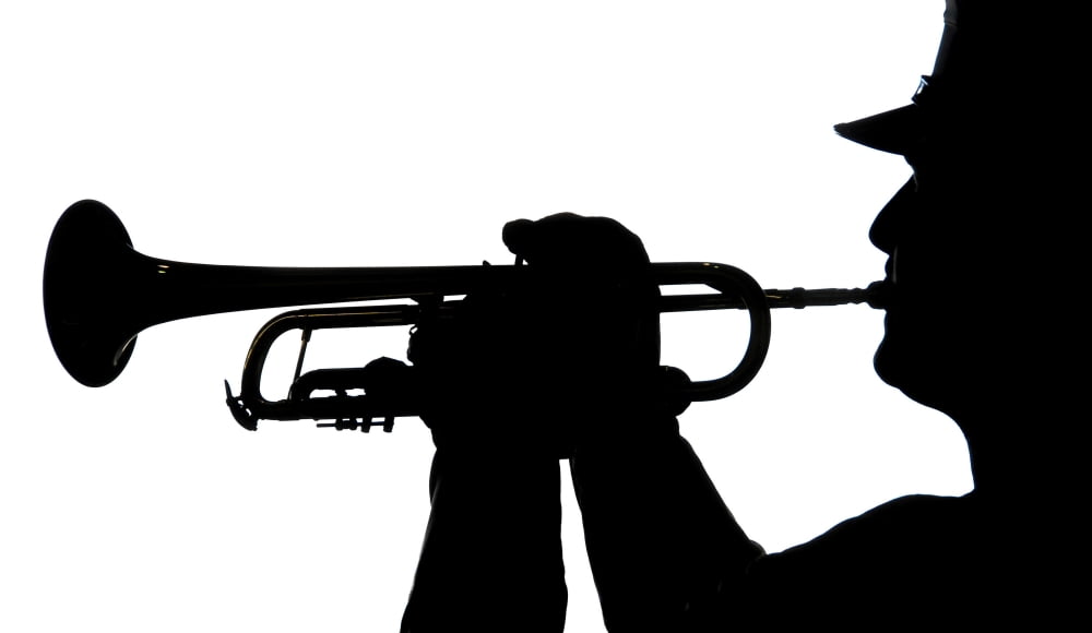 A servicemember plays a tune during a homecoming ceremony Canvas Art - Stocktrek Images (37 x 22)