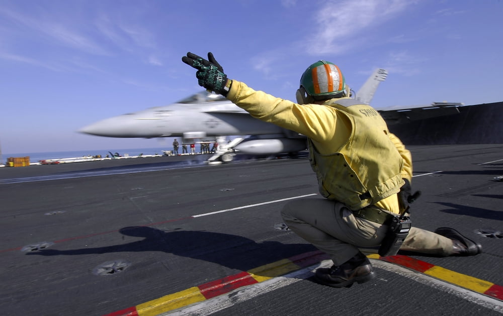 A shooter signals the launch of an FA-18 Super Hornet Canvas Art - Stocktrek Images (35 x 23)