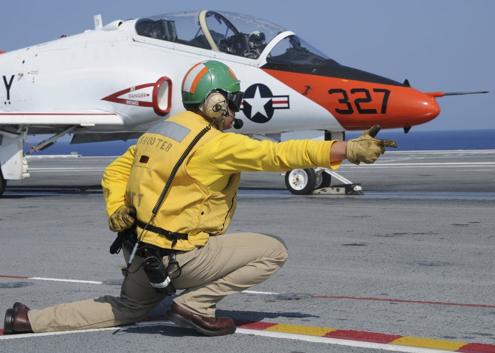 A shooter signlas the launch of a T-45A Goshawk trainer aircraft Canvas Art - Stocktrek Images (34 x 24)
