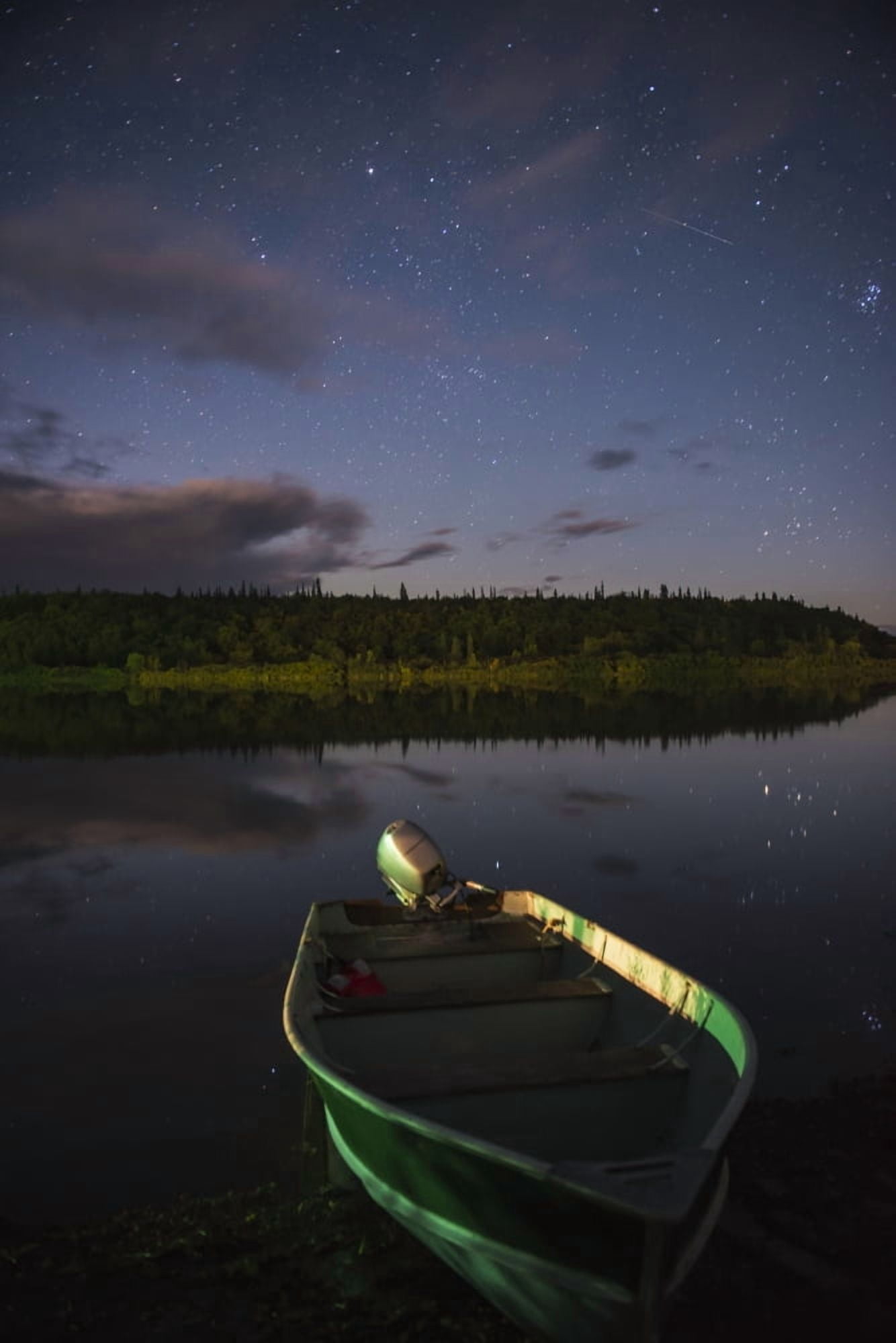 A skiff rests on the banks of the Kvichak River at night Bristol Bay Region Southwest Alaska Canvas Art - Carl Johnson Design Pics (12 x 19)