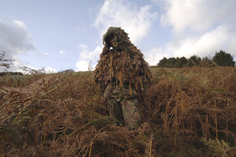 A sniper dressed in a ghillie suit Canvas Art - Andrew ChittockStocktrek Images (34 x 23)