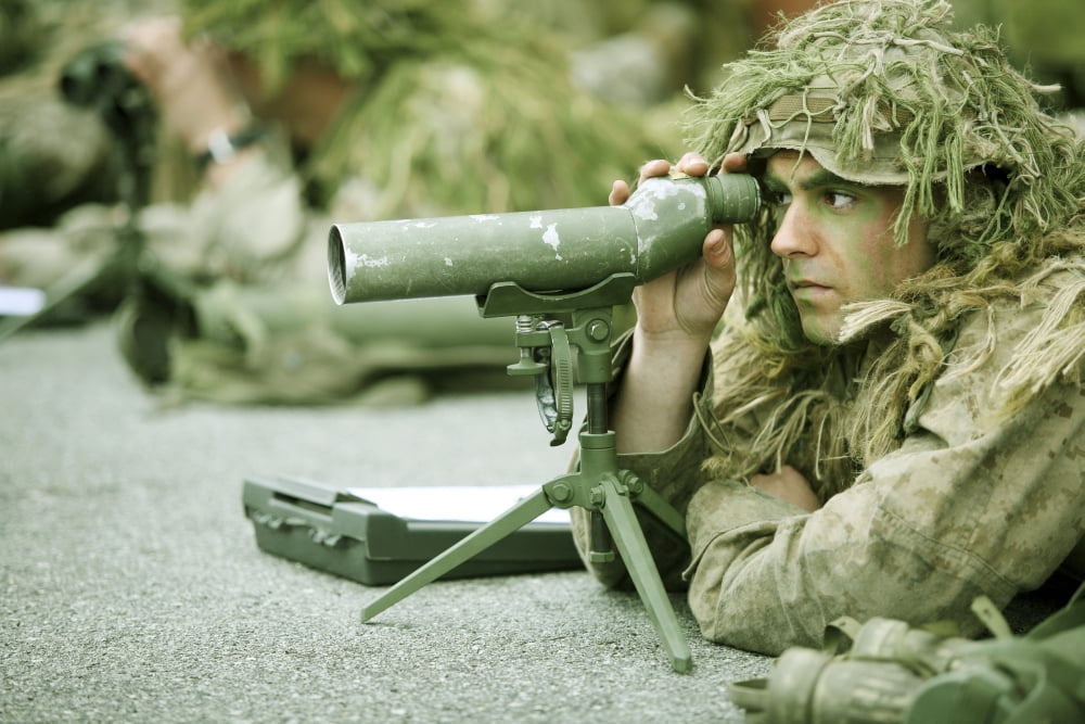 A sniper practices observation techniques through a spotting scope Canvas Art - Stocktrek Images (35 x 24)