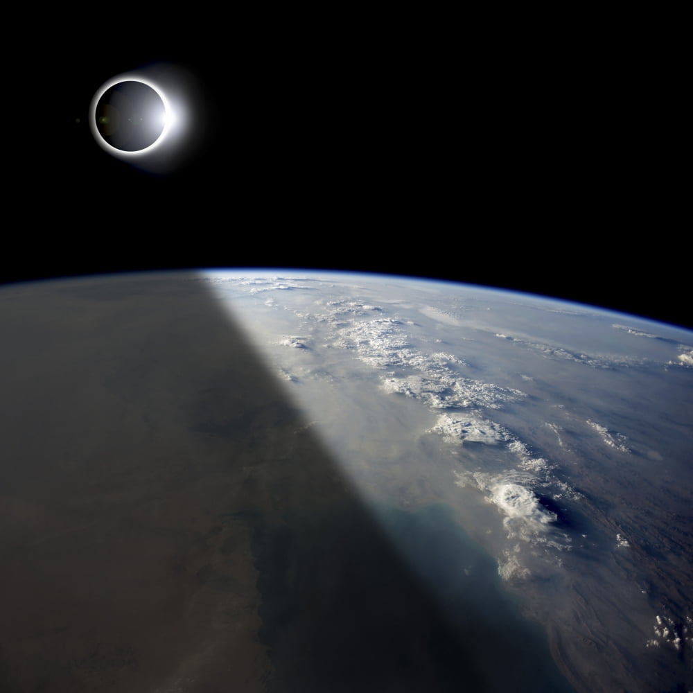A solar eclipses partially shades the Earth below Canvas Art - Marc WardStocktrek Images (29 x 29)