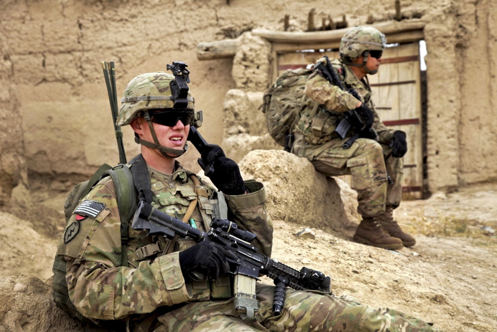 A soldier calls in description of person of interest to higher ups Canvas Art - Stocktrek Images (35 x 23)