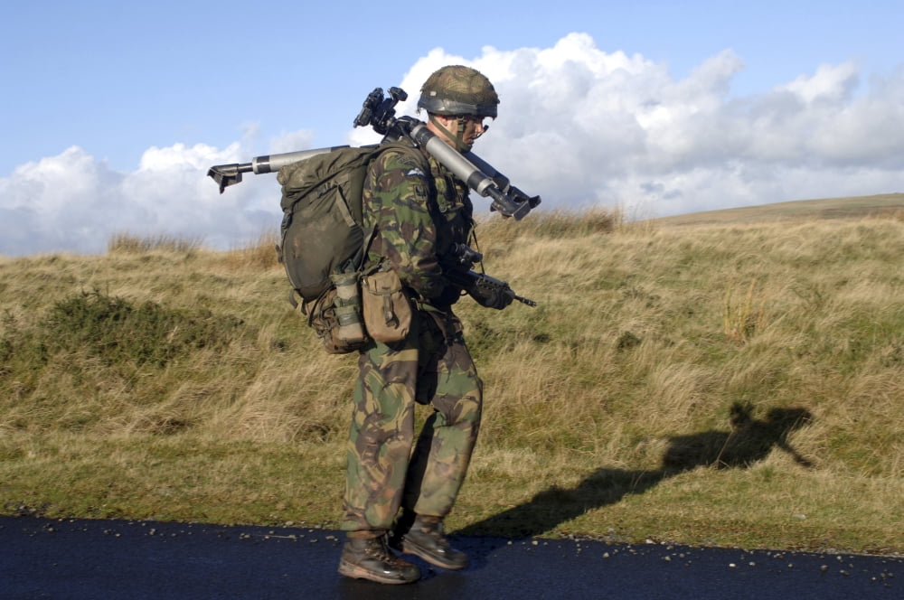 A soldier carries a tripod to a live firing exercise Canvas Art - Andrew ChittockStocktrek Images (34 x 23)