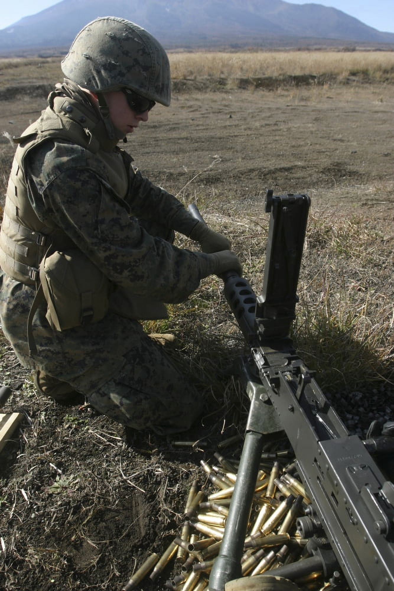 A soldier changes the barrel of an M2 50 caliber machine gun Canvas Art - Stocktrek Images (23 x 34)