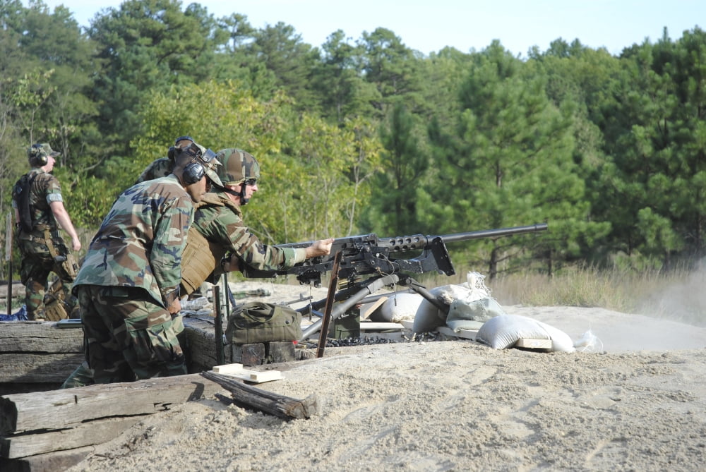 A soldier charges a 50-caliber machine gun on the firing range Canvas Art - Stocktrek Images (34 x 23)