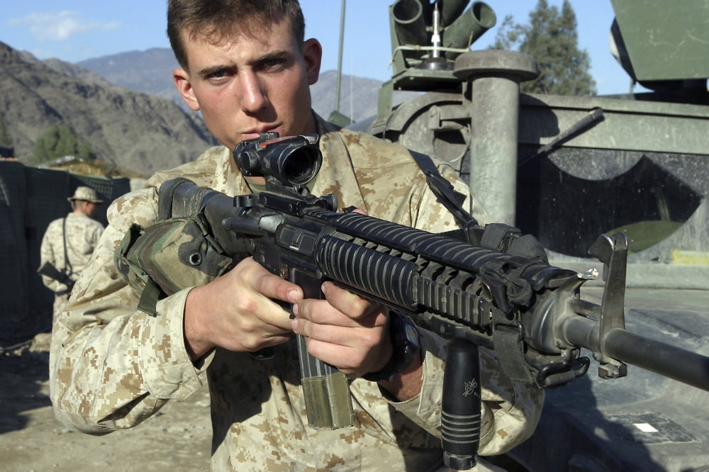 A soldier displays his M16 A4 rifle Canvas Art - Stocktrek Images (34 x 23)