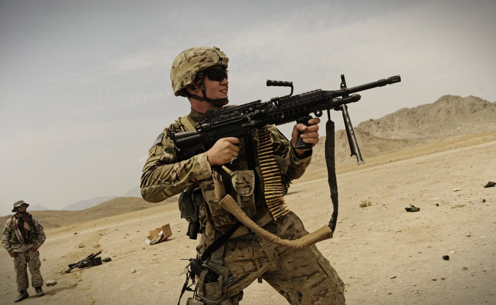 A soldier firing his Mk-48 machine gun Canvas Art - Stocktrek Images (36 x 22)