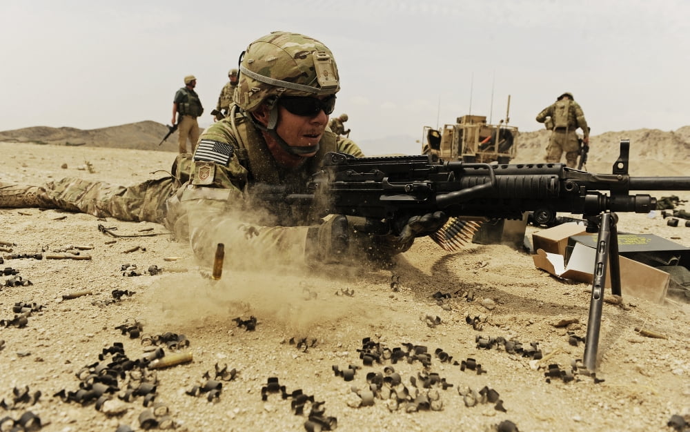 A soldier firing his Mk-48 machine gun Canvas Art - Stocktrek Images (36 x 23)