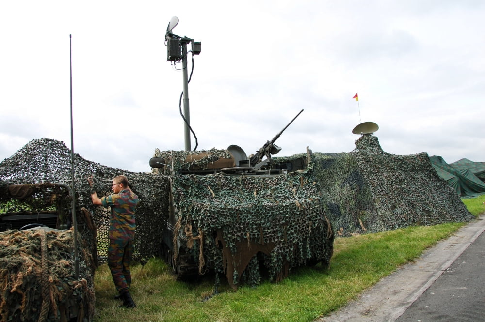 A soldier of the Belgian Army inspecting a unit on the field Canvas Art - Luc De JaegerStocktrek Images (34 x 23)