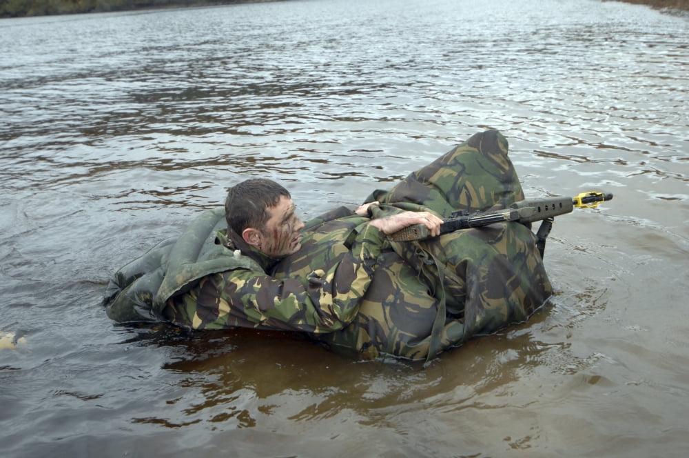 A soldier participates in a river crossing during Exercise Cambrian Patrol Canvas Art - Andrew ChittockStocktrek Images (17 x 12)